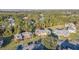 The aerial view displays a well-manicured property with convenient parking, and lush greenery, and mature trees at 133 Blue Heron Dr # C, Daytona Beach, FL 32119