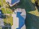 Aerial view of a townhouse complex featuring a well-maintained roof, landscaping, and parking at 133 Blue Heron Dr # C, Daytona Beach, FL 32119