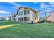 Charming home with a well-manicured lawn, mature trees, and a screened-in patio perfect for outdoor living at 133 Blue Heron Dr # C, Daytona Beach, FL 32119