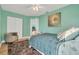 Bedroom with a plush rug, a ceiling fan, closet space, and stylish decor at 133 Blue Heron Dr # C, Daytona Beach, FL 32119