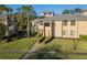 Inviting townhouse with manicured lawns, mature landscaping, and a charming facade at 133 Blue Heron Dr # C, Daytona Beach, FL 32119