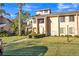Charming townhome featuring a well-kept lawn and a walkway leading to the front door at 133 Blue Heron Dr # C, Daytona Beach, FL 32119