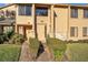Attractive townhouse exterior with manicured landscaping and a stone accent wall at 133 Blue Heron Dr # C, Daytona Beach, FL 32119
