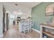 Bright, modern kitchen with stainless steel appliances, an island, and stylish stools at 133 Blue Heron Dr # C, Daytona Beach, FL 32119