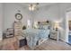 Cozy main bedroom with neutral tones, stylish furniture, and ample natural light at 133 Blue Heron Dr # C, Daytona Beach, FL 32119