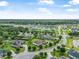 Overhead view of the neighborhood featuring lush greenery, well-maintained streets, and community landscaping at 1357 Liam Cir, Ormond Beach, FL 32174
