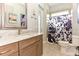 Light and airy bathroom featuring a wooden vanity with marble countertops and tile flooring at 1357 Liam Cir, Ormond Beach, FL 32174