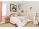 Cozy bedroom with a comfortable bed, decorative wall art, and ample natural light at 1357 Liam Cir, Ormond Beach, FL 32174