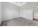 Bright bedroom with carpeting, double closet and adjacent doorway at 1357 Liam Cir, Ormond Beach, FL 32174