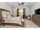 Bedroom with neutral walls, plush carpet, large window and modern furniture at 1357 Liam Cir, Ormond Beach, FL 32174