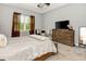 Bedroom with neutral walls, plush carpet, large window and furniture at 1357 Liam Cir, Ormond Beach, FL 32174