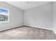Bright, carpeted bedroom featuring neutral tones and a ceiling fan at 1357 Liam Cir, Ormond Beach, FL 32174