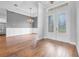 Bright entryway featuring hardwood floors, chandelier, and decorative glass double doors at 1357 Liam Cir, Ormond Beach, FL 32174