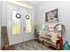 Charming entryway featuring decorative glass doors and rustic-chic decor at 1357 Liam Cir, Ormond Beach, FL 32174