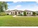 Charming single Gathering home boasting a manicured lawn and beautiful landscaping at 1357 Liam Cir, Ormond Beach, FL 32174