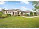 Well-maintained single Gathering home showcasing lush green lawn and decorative landscaping at 1357 Liam Cir, Ormond Beach, FL 32174