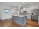 A bright, spacious kitchen with marble countertops, stainless steel appliances, and hardwood floors at 1357 Liam Cir, Ormond Beach, FL 32174