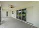 Spacious lanai with sliding glass doors, a ceiling fan, and a view of the backyard at 1357 Liam Cir, Ormond Beach, FL 32174