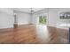 Spacious open floor plan featuring hardwood floors and sliding glass doors to the lanai at 1357 Liam Cir, Ormond Beach, FL 32174