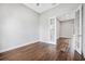 Bright living room with hardwood floors, gray walls, and view to hallway with open doorways at 1357 Liam Cir, Ormond Beach, FL 32174
