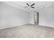 Spacious main bedroom boasts a tray ceiling with fan and neutral decor at 1357 Liam Cir, Ormond Beach, FL 32174