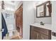 Bathroom featuring dark wood vanity, coordinating fixtures, and a neutral color scheme for a cohesive look at 2 Wildwood Dr, Edgewater, FL 32132