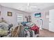 Comfortable bedroom featuring a ceiling fan, window, and a wall-mounted television for relaxation at 2 Wildwood Dr, Edgewater, FL 32132