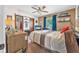Inviting bedroom with neutral tones, a ceiling fan, and a window providing natural light and a peaceful ambiance at 2 Wildwood Dr, Edgewater, FL 32132