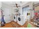 Well-equipped laundry room with washer, dryer, and ample space, with a 'Laundry Room' themed rug at 2 Wildwood Dr, Edgewater, FL 32132