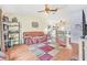 View of the living room featuring wood flooring, ceiling fan, and neutral walls at 2 Wildwood Dr, Edgewater, FL 32132
