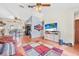View of the living room featuring wood flooring, ceiling fan, and neutral walls at 2 Wildwood Dr, Edgewater, FL 32132