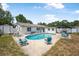 Backyard oasis featuring a refreshing in-ground pool, perfect for relaxation and entertainment at 2 Wildwood Dr, Edgewater, FL 32132