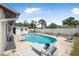 Fenced in pool with lounge seating and a covered seating area at 2 Wildwood Dr, Edgewater, FL 32132
