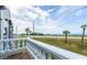 Balcony with scenic ocean views and white railing at 3074 Ocean Shore Blvd, Ormond Beach, FL 32176