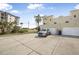 Exterior shot showcases attached garages for convenient parking, plus manicured landscaping at 3074 Ocean Shore Blvd, Ormond Beach, FL 32176