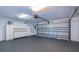 Spacious garage features storage cabinets, a utility sink, and an automatic garage door at 3074 Ocean Shore Blvd, Ormond Beach, FL 32176