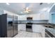 Modern kitchen with stainless steel appliances, granite countertops, and ample storage at 3074 Ocean Shore Blvd, Ormond Beach, FL 32176