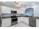 Bright kitchen featuring granite countertops, stainless steel appliances, and updated cabinetry at 3074 Ocean Shore Blvd, Ormond Beach, FL 32176