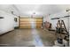 The garage with overhead lighting, shelving and an aluminum ladder at 3076 Ocean Shore Blvd, Ormond Beach, FL 32176