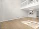 Bright, open living space with tile flooring and a second-floor balcony at 3076 Ocean Shore Blvd, Ormond Beach, FL 32176