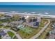 Aerial view showcasing the condo buildings and its proximity to the beach and neighborhood at 3370 Ocean Shore Blvd # 205-B, Ormond Beach, FL 32176