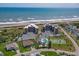 Oceanfront condo complex with amenities like a pool, tennis court, and private beach access, showcasing coastal living at 3370 Ocean Shore Blvd # 205-B, Ormond Beach, FL 32176