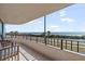 Balcony view of ocean, street, palm trees, and calming ocean breezes at 3370 Ocean Shore Blvd # 205-B, Ormond Beach, FL 32176
