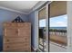 View of the ocean from the balcony through the bedroom window at 3370 Ocean Shore Blvd # 205-B, Ormond Beach, FL 32176
