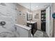 Bathroom with a stand-up shower, marble surround and a dark wood vanity at 3370 Ocean Shore Blvd # 205-B, Ormond Beach, FL 32176