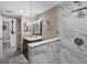 Updated bathroom featuring elegant shower with marble accents and glass enclosure at 3370 Ocean Shore Blvd # 205-B, Ormond Beach, FL 32176