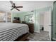 Bedroom featuring stylish shutters, light green walls, and ceiling fan at 3370 Ocean Shore Blvd # 205-B, Ormond Beach, FL 32176