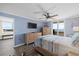 Bedroom with a ceiling fan, light blue walls and a balcony with a view of the ocean at 3370 Ocean Shore Blvd # 205-B, Ormond Beach, FL 32176