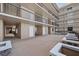 Well-maintained common area featuring multiple hallways, a stone bench and neutral color scheme at 3370 Ocean Shore Blvd # 205-B, Ormond Beach, FL 32176