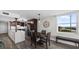 Open concept dining with ocean views and sightlines to the modern kitchen at 3370 Ocean Shore Blvd # 205-B, Ormond Beach, FL 32176